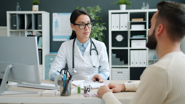 Doctor consults with patient in medical office